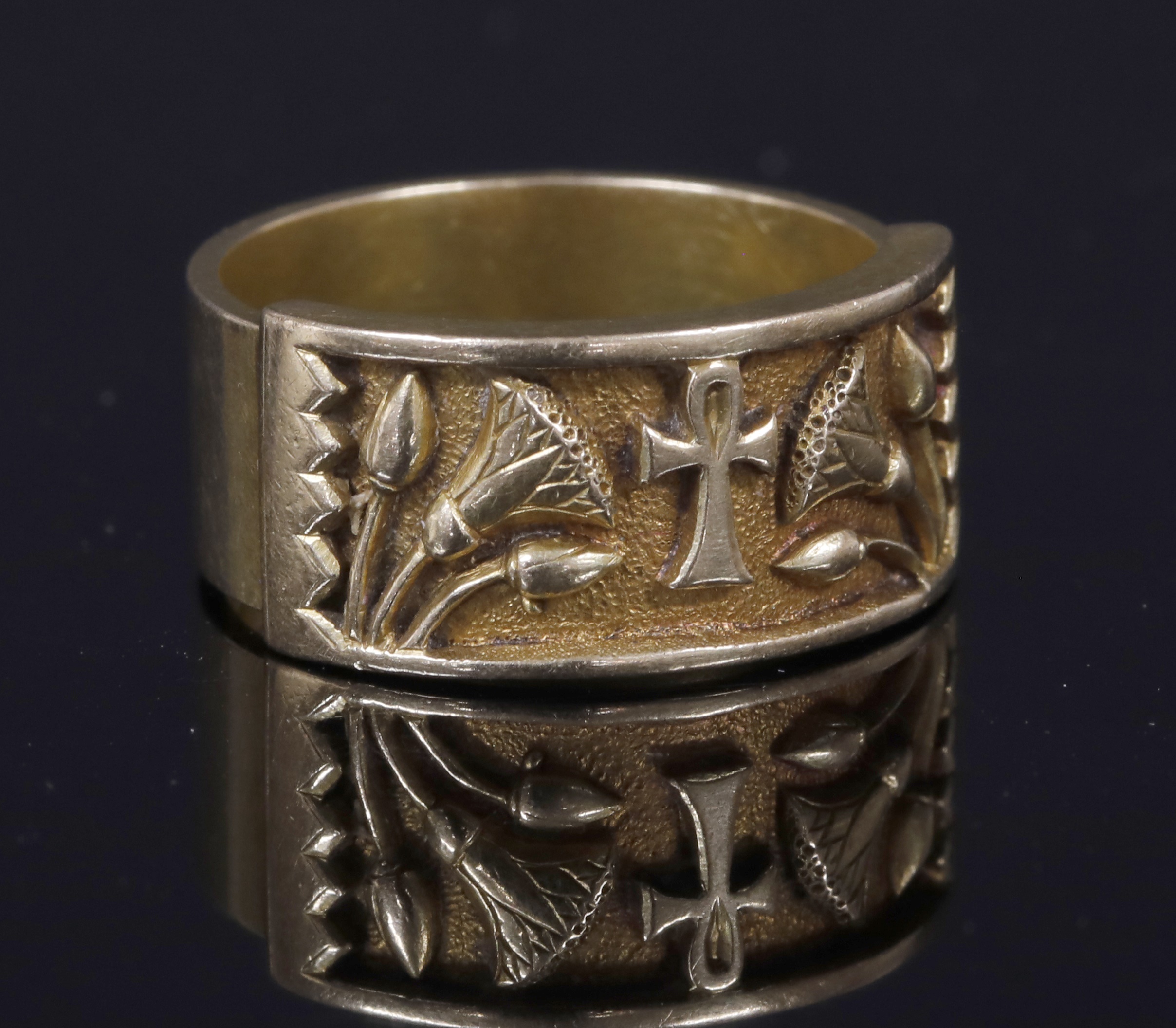 An Egyptian Revival ring, c.1900, with ankh and lotus motifs. The ankh hieroglyph represents the word for life, whilst the lotus flower was associated with Sun god Atum-Ra and symbolised creation and rebirth.  Lot 145, Fine Jewellery Sale, 19th November 2019 Hammer £380